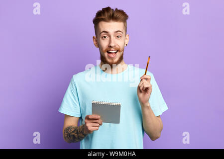 young businessman planning his working day. great idea. Successful man planning business meeting. Young entrepreneur making up successful great idea.l Stock Photo