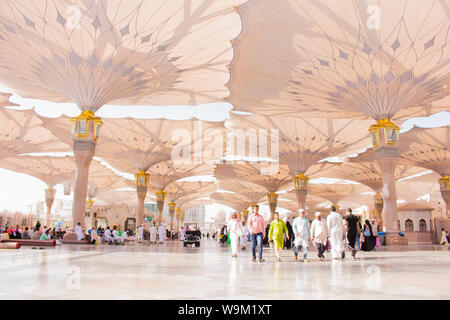 MADINAH, SAUDI ARABIA - AUGUST 2019 : Muslim pilgrims visiting the beautiful Nabawi Mosque destination, the Prophet mosque which has great architectur Stock Photo