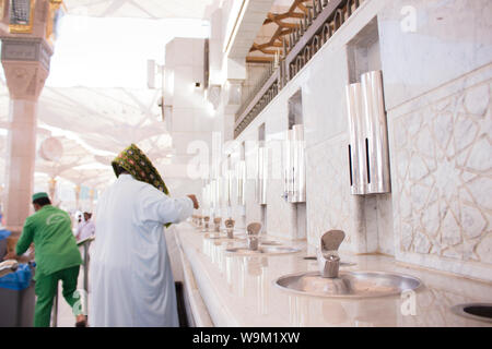 MADINAH, SAUDI ARABIA - AUGUST 2019 : Muslim pilgrims visiting the beautiful Nabawi Mosque destination, the Prophet mosque which has great architectur Stock Photo