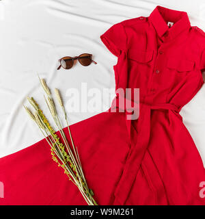 woman's clothes which she has bought on sale in the shopping mall. trade, business, creative presentation of dress Stock Photo