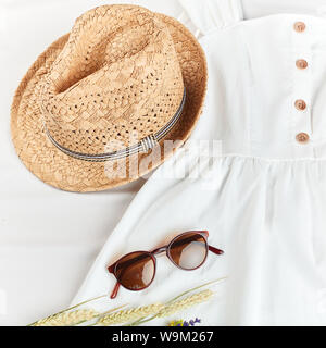 stylish straw hat helps you on a hot summer vacation. fashionable clothes for travelling . top view photo Stock Photo