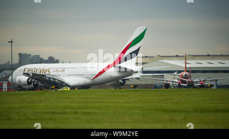 Glasgow, UK. 4 June 2019. Emirates Airbus A380 Super Jumbo seen at Glasgow departing for Dubai.  Credit: Colin Fisher/CDFIMAGES.COM