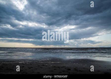 Stormy clouds over Maryport beach Stock Photo