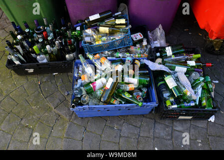 A selection of empty wine and beer bottles pictured set out for recycling in Brighton, East Sussex, UK. Stock Photo