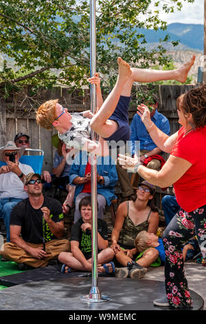 Child performing pole act; Salida Circus summer camp finale; Salida; Colorado; USA Stock Photo
