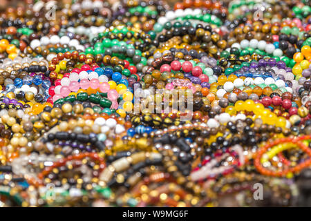 Mixed colors beads close-up made from natural stones or glass marbles Stock Photo