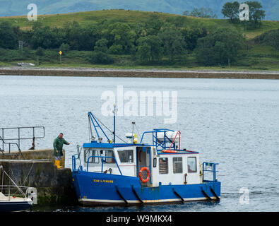 The Lismore passenger ferry prepares to depart from Port Appin pier on route to Lismore Island, Argyll. Stock Photo