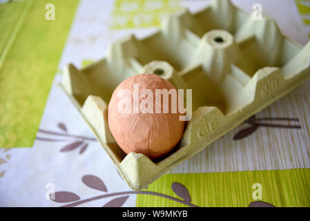 Deformed Chicken Egg in an egg box purchased on holiday vacation in Costa Blanca, Spain, Europe. Food standards. Abnormality in laying. Calcium Stock Photo