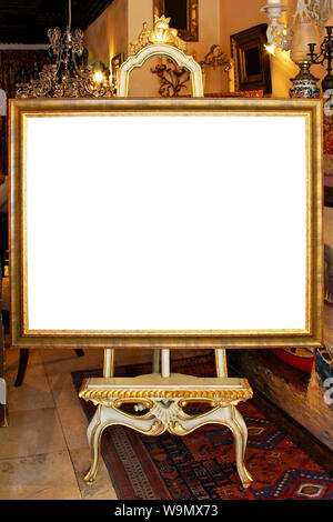 Floor easel with empty frame isolated included clipping path Stock Photo