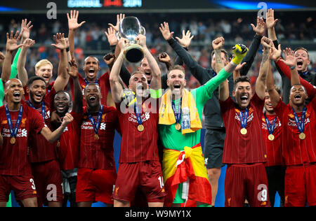 Liverpool's Jordan Henderson lifts the trophy after his side win the UEFA Super Cup Final at Besiktas Park, Istanbul. Stock Photo