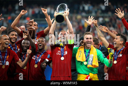 Liverpool's Jordan Henderson lifts the trophy after his side win the UEFA Super Cup Final at Besiktas Park, Istanbul. Stock Photo