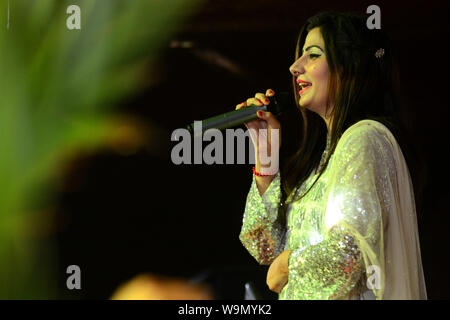 QUETTA, PAKISTAN, Aug 14-2019: famous Pashto singer Sameena Naz performing song during musical event regarding the celebration of Pakistan Independenc Stock Photo