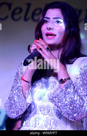 QUETTA, PAKISTAN, Aug 14-2019: famous Pashto singer Sameena Naz performing song during musical event regarding the celebration of Pakistan Independenc Stock Photo