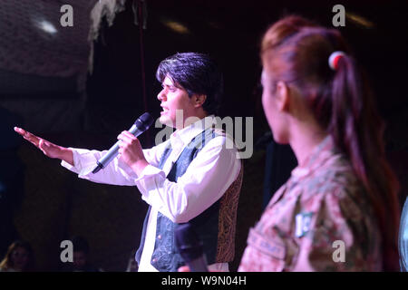 QUETTA, PAKISTAN, Aug 14-2019: Pakistani Drama Artist Abdullah Achakzai and film star pakiza khan performing during musical event the celebration of P Stock Photo