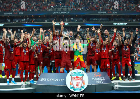 Liverpool's Jordan Henderson lifts the trophy after his side win the UEFA Super Cup Final at Besiktas Park, Istanbul. Stock Photo