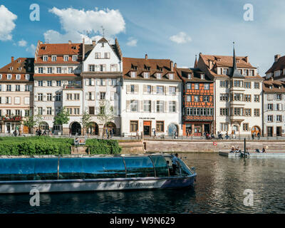 Strasbourg, France - May 5, 2019: Quai des Batelier pedestrian street in central Strasbourg with Batorama tourist boat and Alsatian architecture Stock Photo