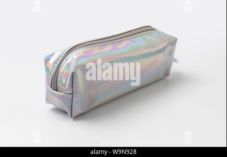 Holographic silver pencil case on white background. Stock Photo