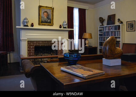 The Library with a portrait of the homeowner, Pulitzer Prize winning author, William Faulkner, inside his residence, Rowan Oak, Oxford, MS Stock Photo