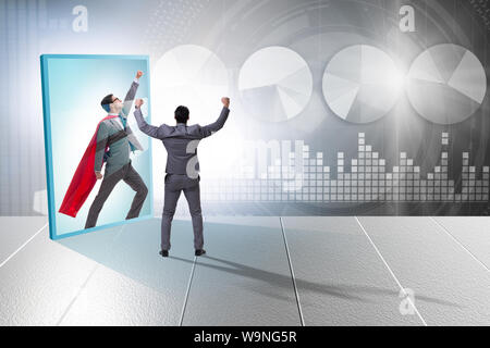 The businessman seeing himself in mirror as superhero Stock Photo - Alamy