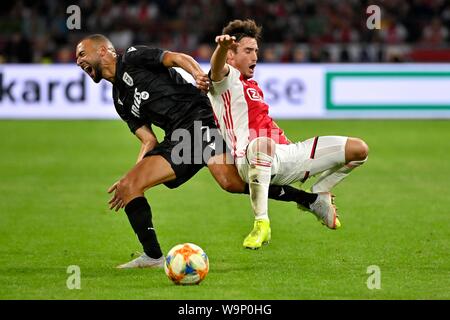 Nicolas Tagliafico (Ajax) and Omar El Kaddouri during the UEFA Champions League third round qualifying second leg match between Ajax Amsterdam and PAOK FC at the Johan Cruijff Arena on August 13, 2019 in Amsterdam, The Netherlands Credit: Sander Chamid/SCS/AFLO/Alamy Live News Stock Photo