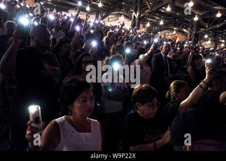 El Paso, Texas, USA. 14th Aug, 2019. People gather during a vigil for ...