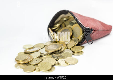 Coin purse filled with coins isolated Stock Photo