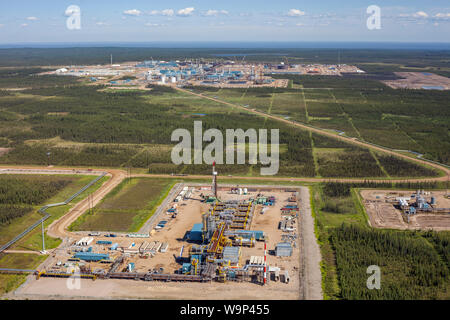 Aerial photo of drilling rig at Suncor Firebag SAGD (Steam Assisted Gravity Drainage) operation in final stages of construction. Stock Photo