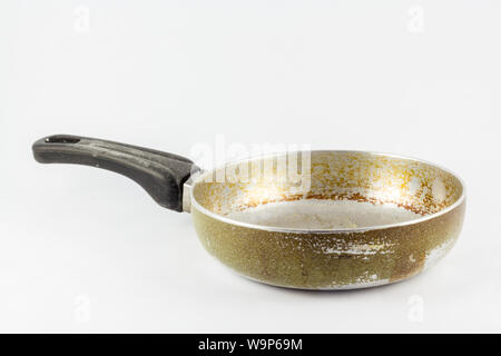 Dirty old frying pan. Isolated on white background Stock Photo