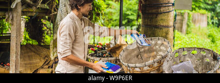 Man separately picks up trash. Separate garbage collection concept BANNER, LONG FORMAT Stock Photo