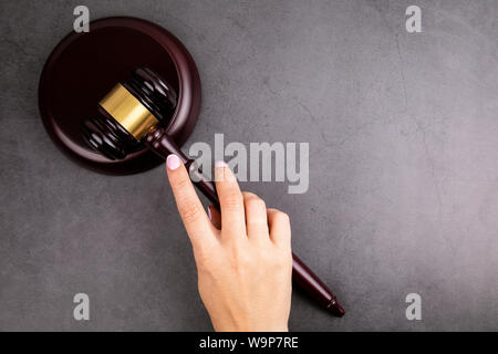 Judge hammer in hand of woman Stock Photo