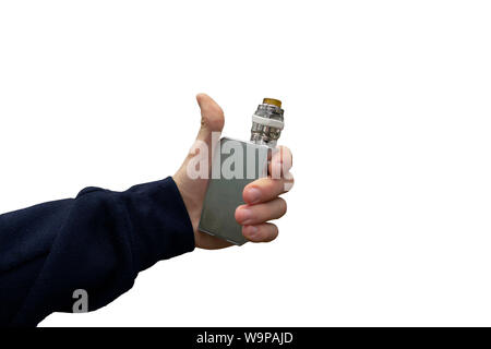 Vaporizer in hand. Man holds vape e-cigarrete device with thumbs-up gesture on isolated background. Concept of alternative smoking as positive or nega Stock Photo