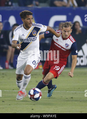 Los Angeles, California, USA. 14th Aug, 2019. LA Galaxy midfielder Jonathan dos Santos (8) and FC Dallas midfielder Paxton Pomykal (19) vie for the ball during the 2019 Major League Soccer (MLS) match between LA Galaxy and FC Dallas in Carson, California, August 14, 2019. Credit: Ringo Chiu/ZUMA Wire/Alamy Live News Stock Photo