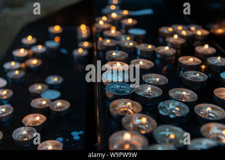 Prayer candles in a church Stock Photo