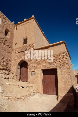 Ait Ben Haddou Kasbah, old medieval town in Morocco desert, castle fort gate, clay mud houses ruins, river in the mountiains Stock Photo