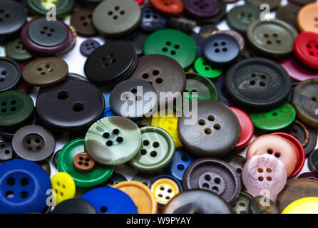 Background from multi-colored randomly scattered buttons. Stock Photo