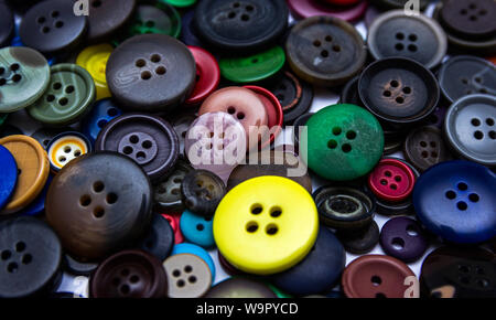 Background from multi-colored randomly scattered buttons. Stock Photo