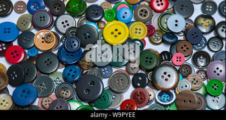 Background from multi-colored randomly scattered buttons. Stock Photo
