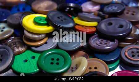 Background from multi-colored randomly scattered buttons. Stock Photo