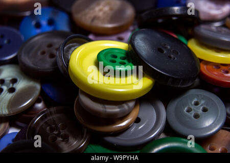 Background from multi-colored randomly scattered buttons. Stock Photo
