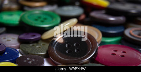 Background from multi-colored randomly scattered buttons. Stock Photo
