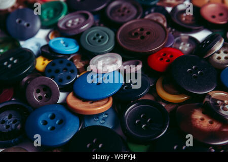 Background from multi-colored randomly scattered buttons. Stock Photo
