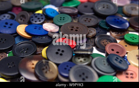 Background from multi-colored randomly scattered buttons. Stock Photo