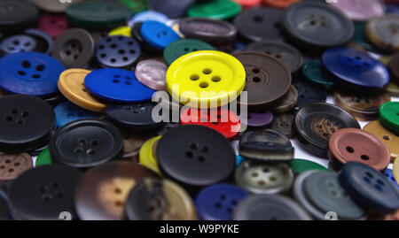 Background from multi-colored randomly scattered buttons. Stock Photo