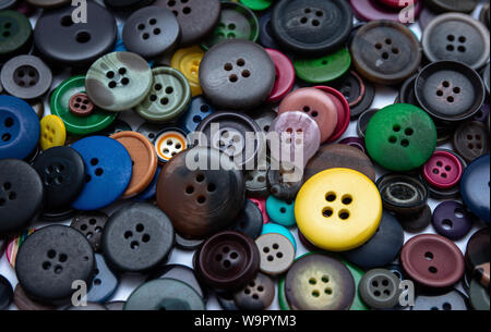 Background from multi-colored randomly scattered buttons. Stock Photo