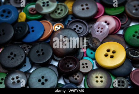 Background from multi-colored randomly scattered buttons. Stock Photo