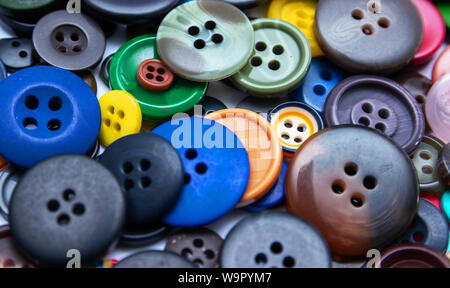 Background from multi-colored randomly scattered buttons. Stock Photo