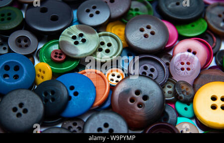 Background from multi-colored randomly scattered buttons. Stock Photo