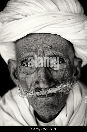 Old Rajasthani man with traditional turban and moustache in Jaisalmer, India Stock Photo