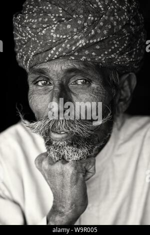Old Rajasthani man with traditional turban and moustache in Jaisalmer, India Stock Photo