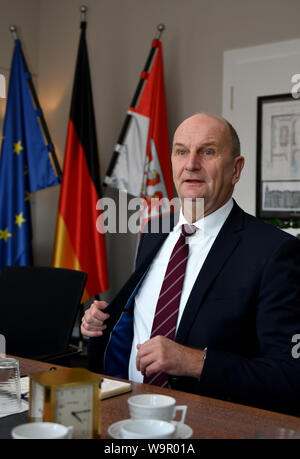 Potsdam, Germany. 11th Mar, 2019. Brandenburg's Prime Minister Dietmar Woidke (SPD) during an interview at his desk in his study at the Potsdam State Chancellery. Credit: Thomas Uhlemann/dpa-zentralbild/ZB/dpa/Alamy Live News Stock Photo